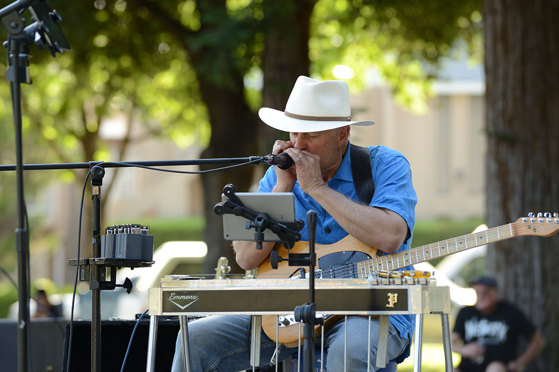 Peter Morgsn playing harmonica, guitar and pedal dteel with Whiskey Kiss